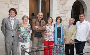 Fotografia dels guardonats, amb els representants del gremi i de la família Rodeja.